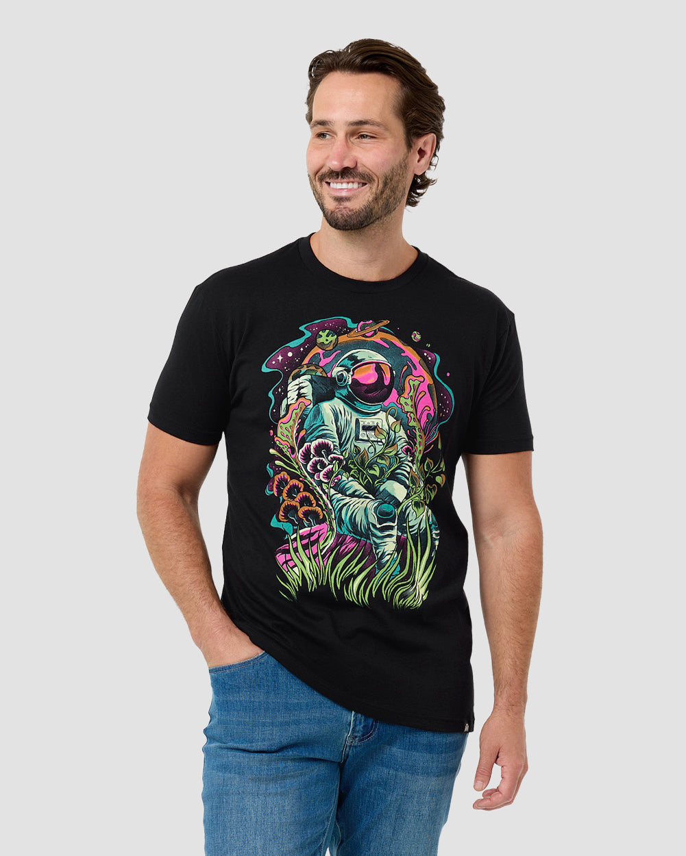 Man wearing the INTO THE AM Galactic Jungle graphic tee