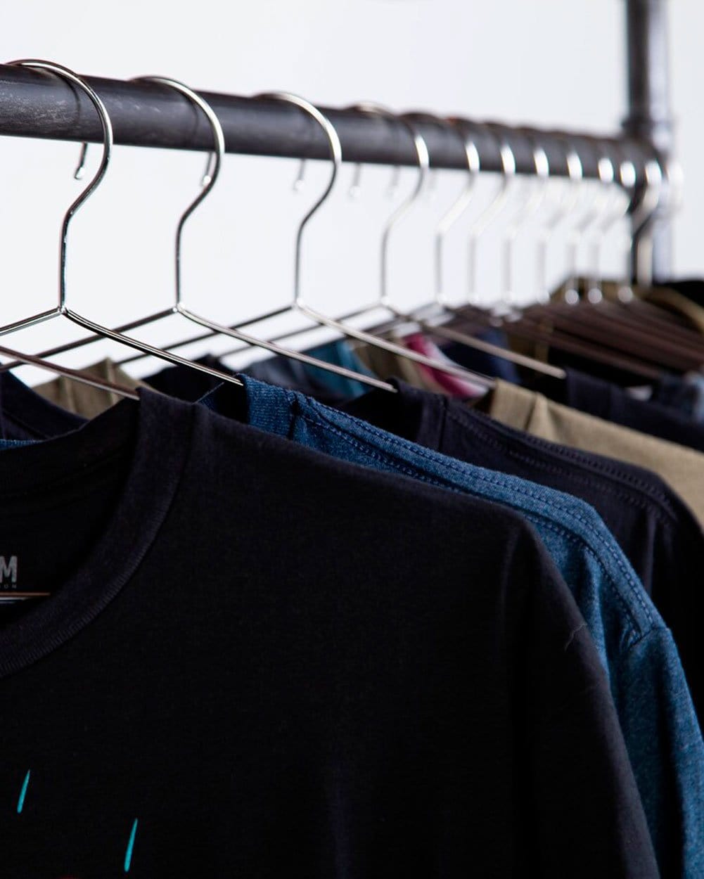INTO THE AM Tee Club graphic tees laid out together, a monthly graphic tee subscription that makes an easy gift