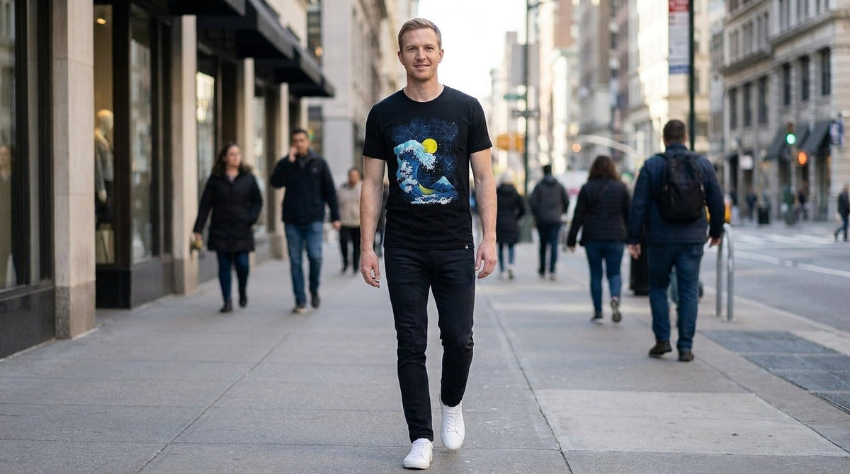 Man in the Mosaic Tide graphic tee with a fitted cut walking down a city sidewalk